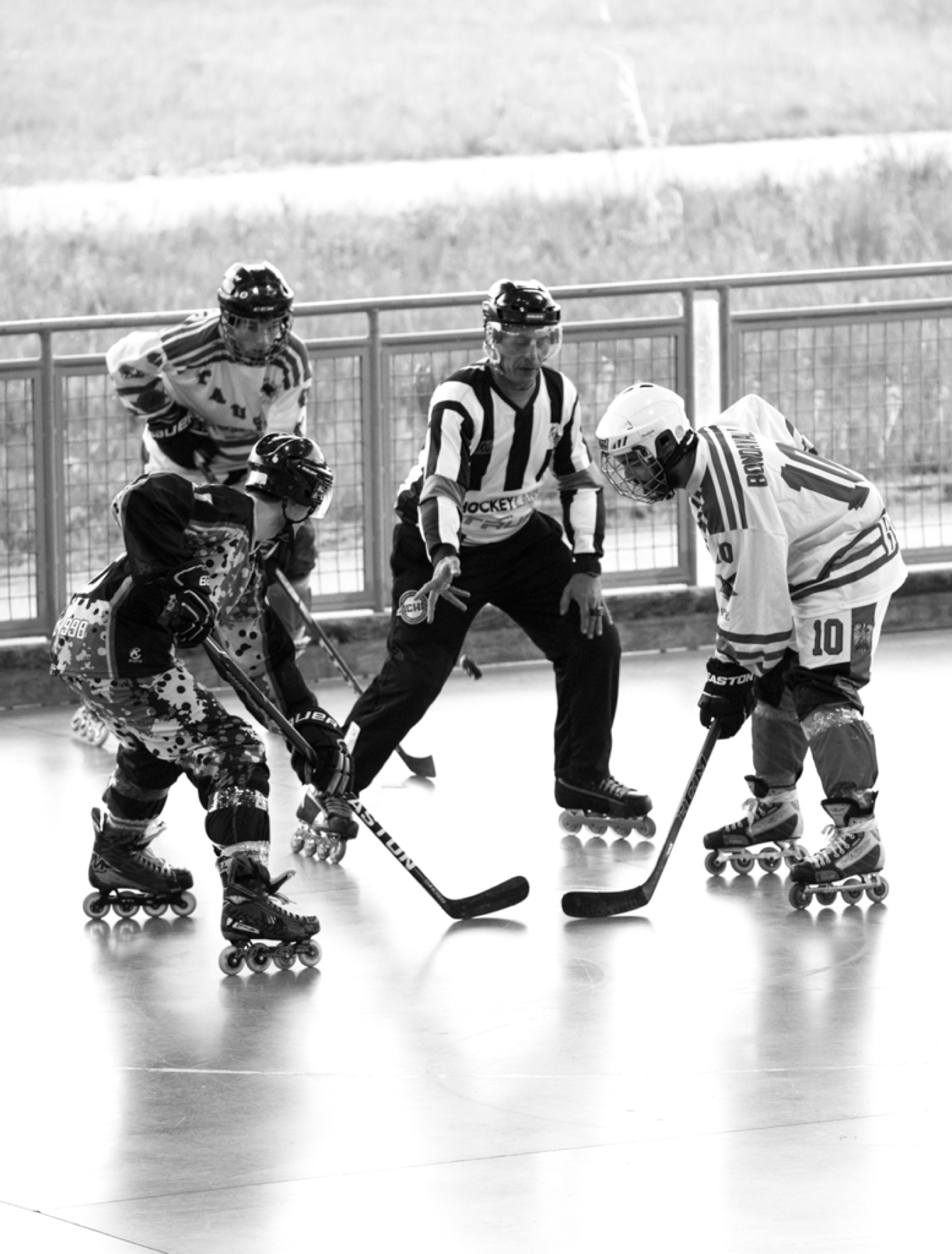 Inline hockey game, black and white