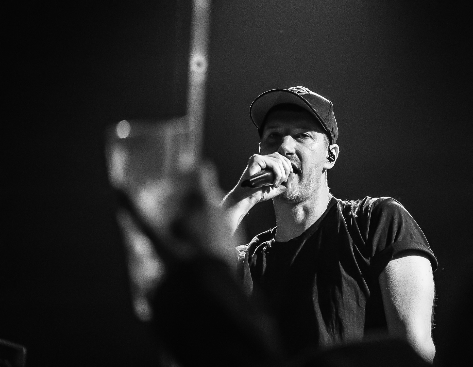 Singer performing on stage, black and white