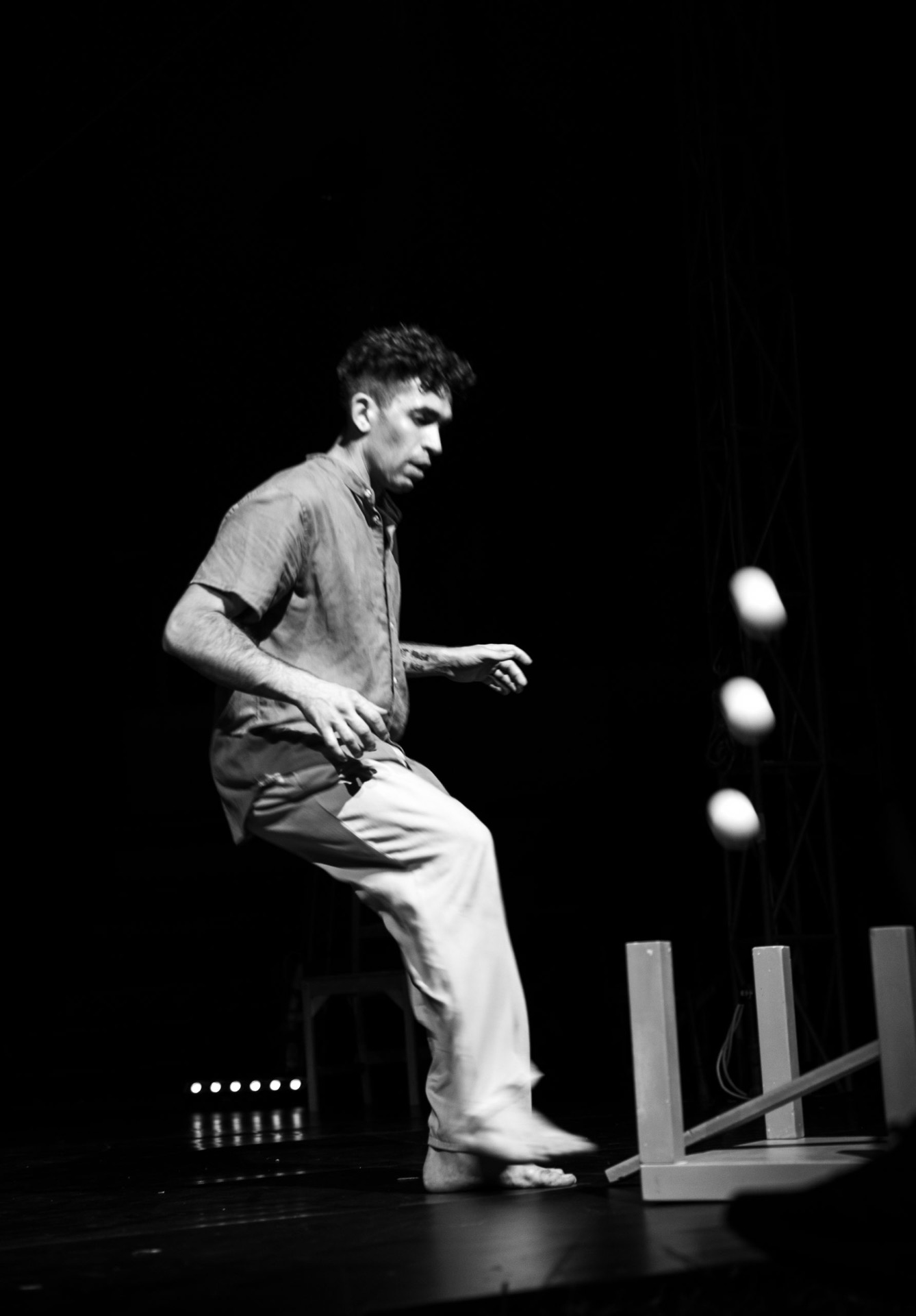 Performer on stage, black and white