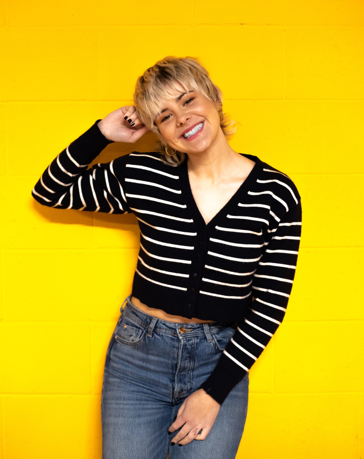 Portrait against a yellow wall