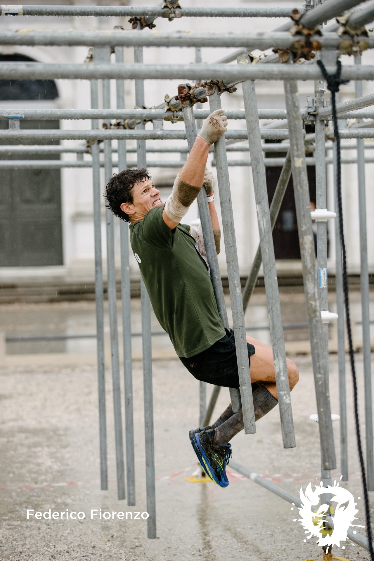 Obstacle race athlete on monkey bars