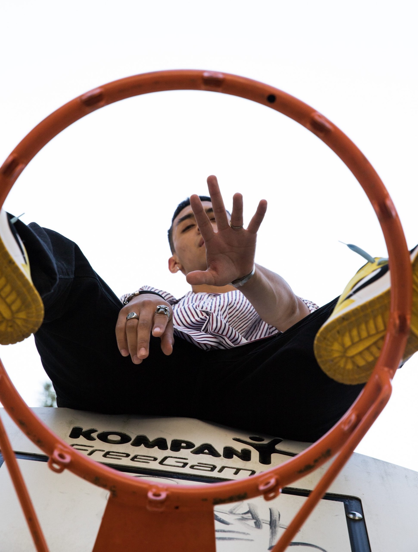 Portrait through a basketball hoop
