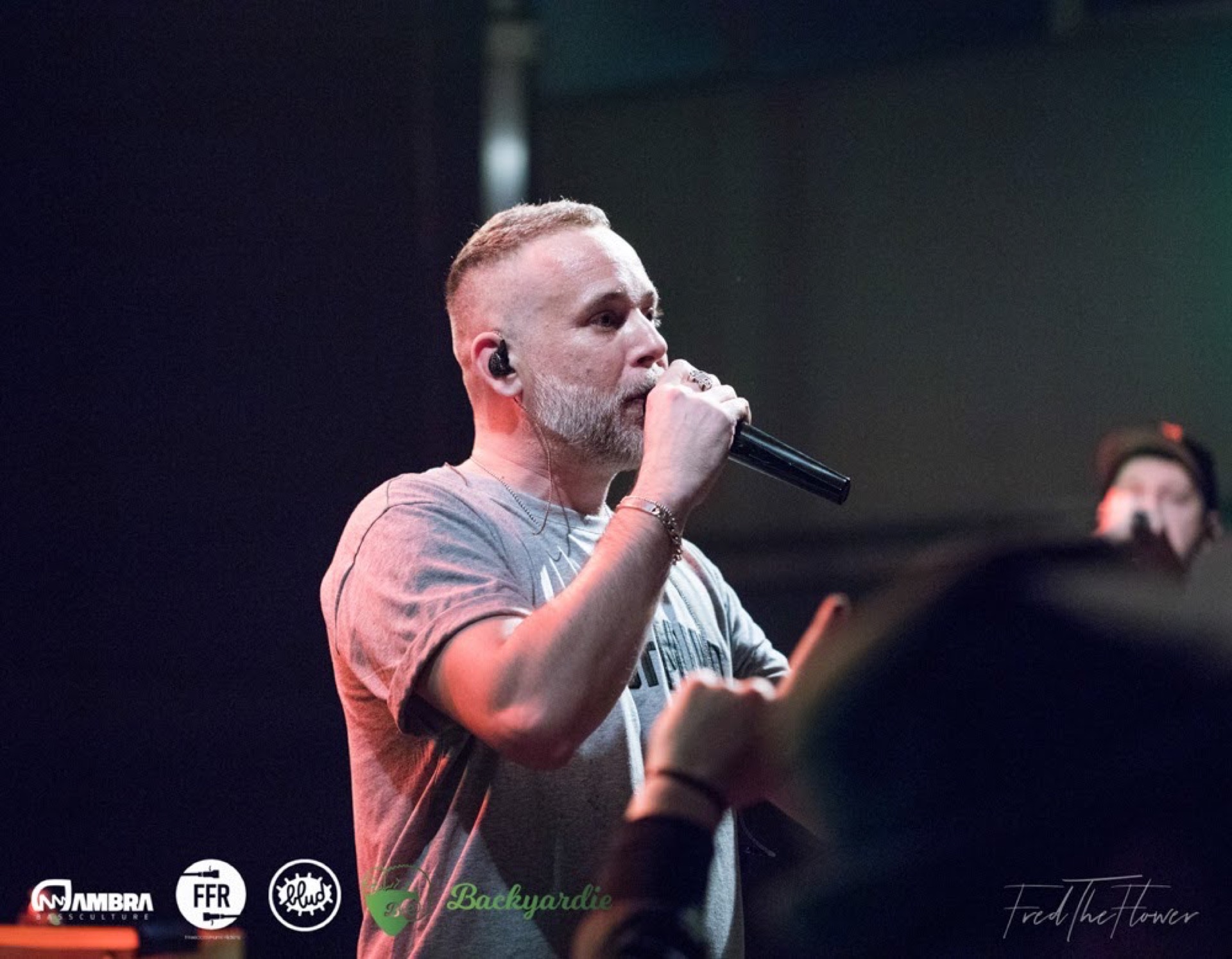 Rapper Mistaman performing live with microphone