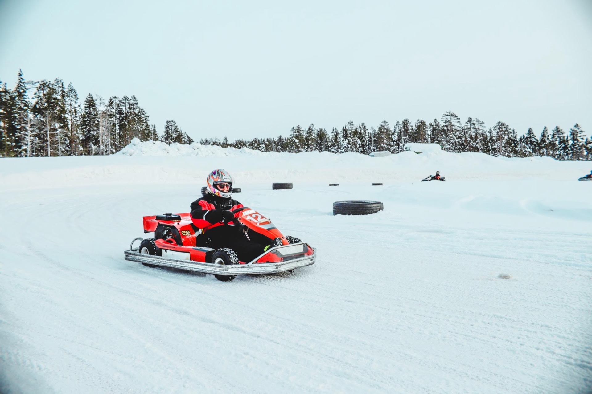 Go-kart racing on a snow and ice track in winter