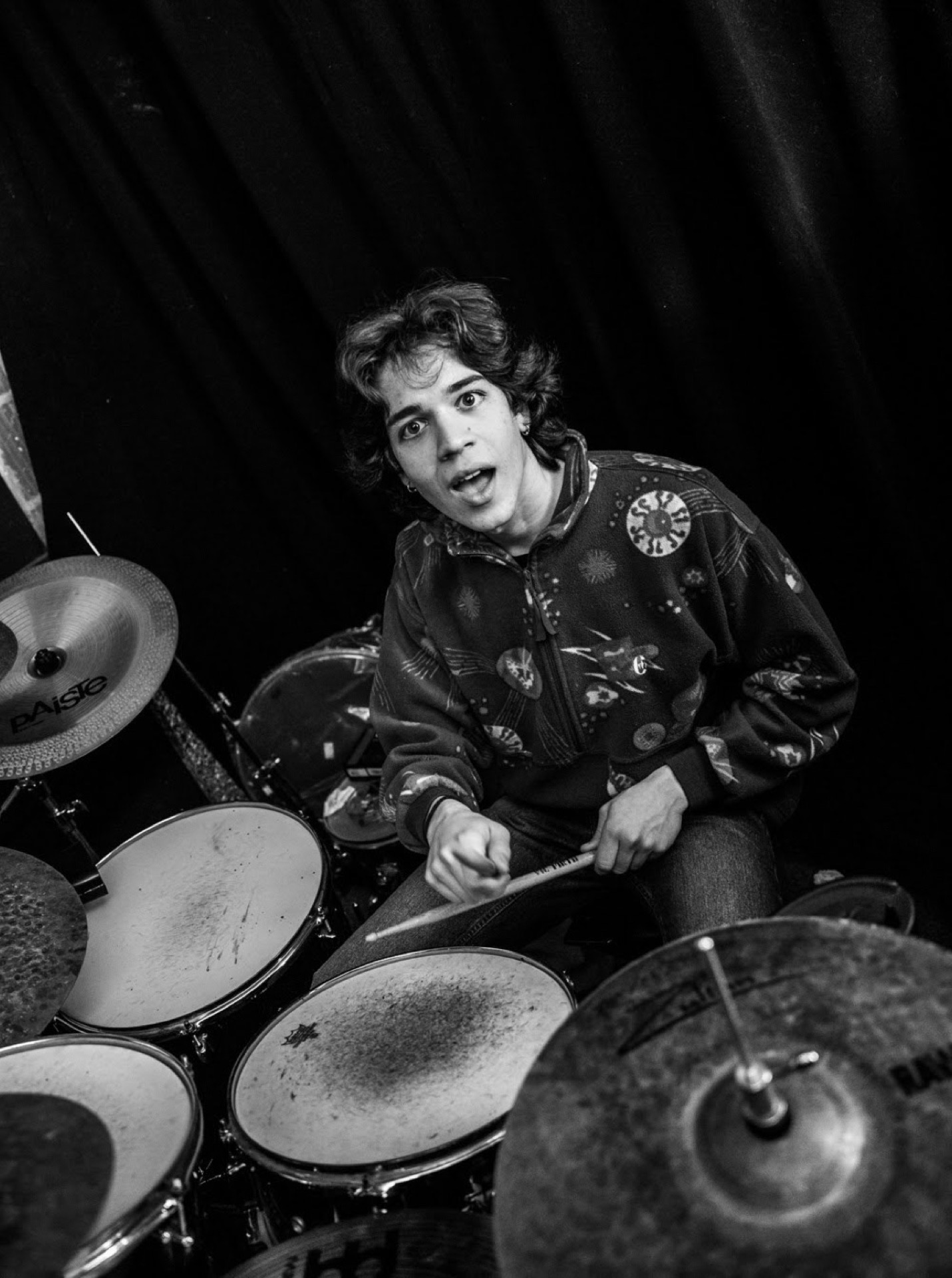 Drummer playing, overhead angle, black and white