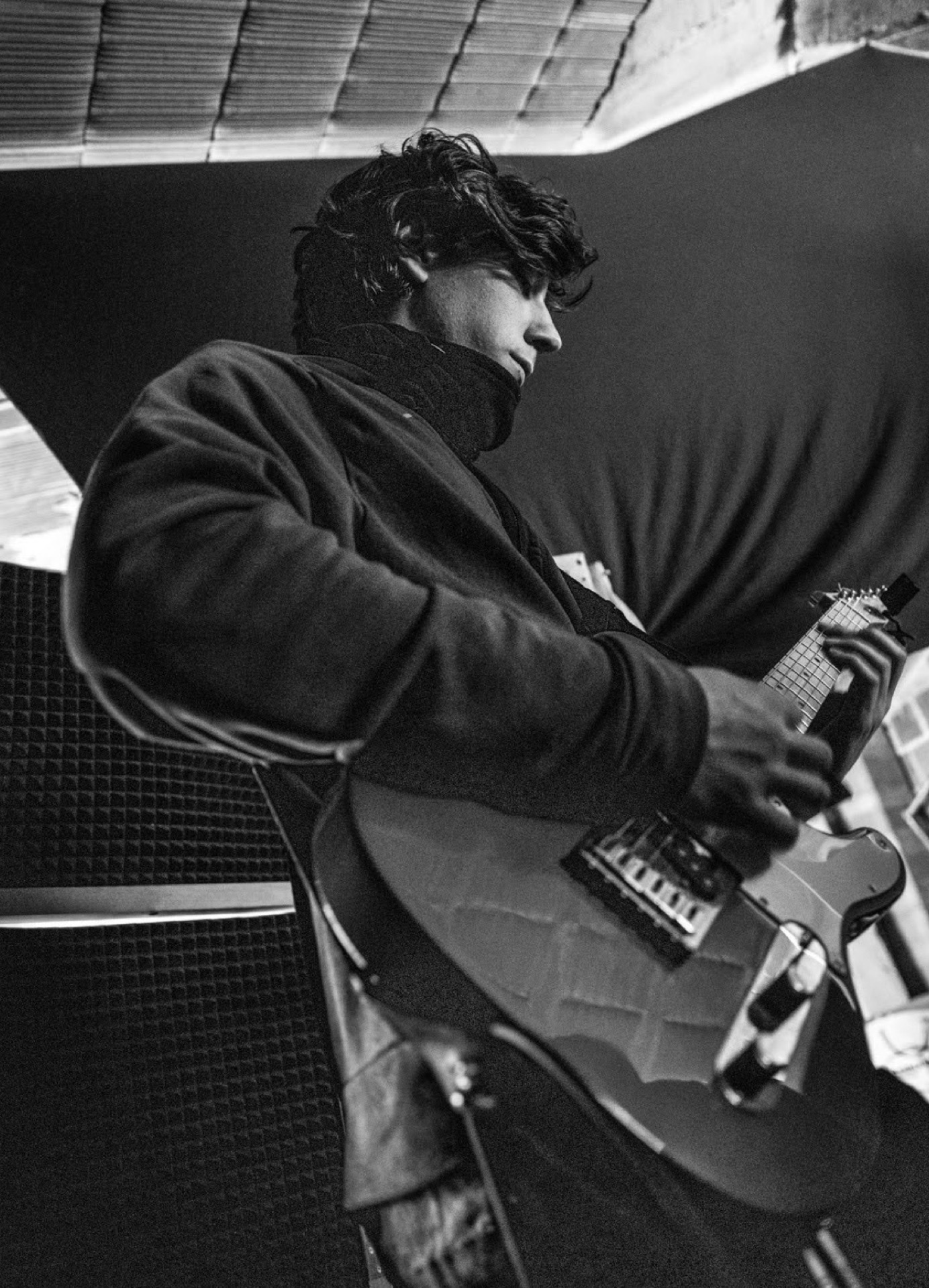 Guitarist in a recording studio, black and white